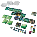 A board game components set laid out on a white background, including multiple illustrated cards, green and blue tokens, a small box, several translucent plastic pieces, and a few colored counters.