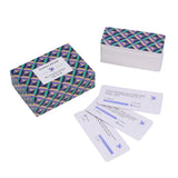 Geometric-patterned card game boxes with cards on a white background