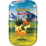 Pokémon trading card game packaging with Pikachu and other characters on a grassy field background.