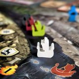 Close-up of a game piece on a board with colorful markers in the background