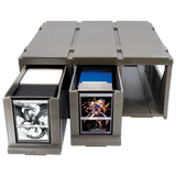 Card storage box with multiple compartments containing trading cards on a white background
