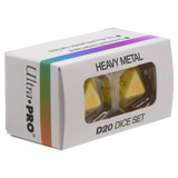 Ultra-Pro Heavy Metal D20 Dice Set in its original white packaging box with a clear window showing two yellow dice inside.