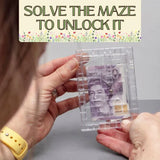 Clear maze puzzle with a banknote design held by hands, text 'Solve the maze to unlock it' at the top.
