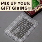 Transparent maze-like object on a gray surface with text 'Mix Up Your Gift Giving' at the top.