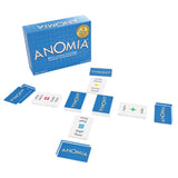 The Anomia word game set, including the blue box, several blue and white cards, and a gold award seal, displayed on a clean white background.