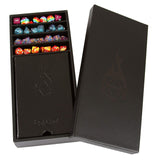 Black dice storage box with colorful dice inside, featuring a pentagonal logo.