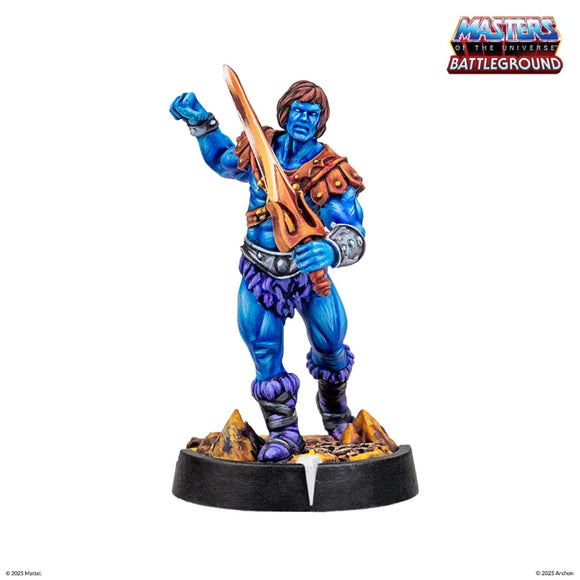 Blue figurine with a weapon on a white background, featuring 'Masters of the Universe Battleground' logo.