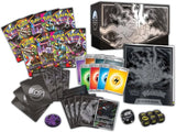 Collection of trading cards, a deck box, and dice with a Pokémon theme on a white background.