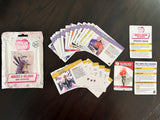 A sealed 'Origin Story' trading card pack sits on a dark wooden table alongside several fanned-out cards and a few standalone cards, all from the Marvel Champions: The Board Game.
