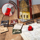 Board game components including cards, a lock, and a scoresheet on a wooden surface.