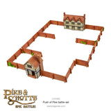 Model of a medieval village with houses and walls, featuring the Pike & Shotte Epic Battles logo.