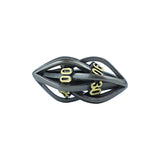 Black and gold elliptical die on a white background