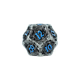 Decorative metal die with blue numbers on a white background