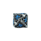 Metallic dice with blue numbers on a white background