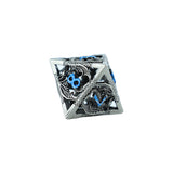 Metal polyhedral dice with blue numbers on a white background
