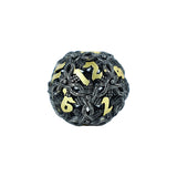 Decorative dice with black and gold design on a white background