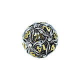 Silver and gold decorative die on a white background