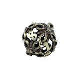 Decorative metal die with intricate designs on a white background