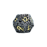 Decorative die with intricate patterns and gold numbers on a white background