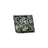 Black and gold polyhedral dice with numbers on a white background