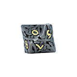 Gray die with gold numbers on a white background