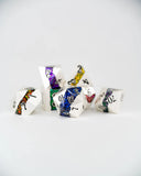 Set of colorful polyhedral dice on a white background