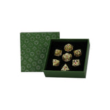 Set of decorative dice with gemstone-like inlays in a green box with geometric pattern