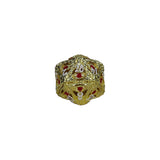 Gold metallic die with red and white designs on a white background