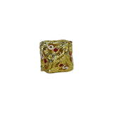 Gold dice with red gems on a white background