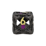 Black textured cube with a yellow and purple design on a white background
