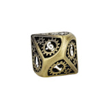 Gold metal dice with gear design on a white background