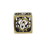 Decorative cube with cut-out design and number '6' on a white background