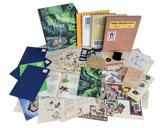 Collection of books, letters, and stationery items on a white background