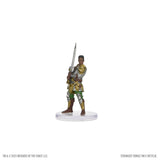 Miniature figurine of a warrior in ornate armor with a sword on a white background