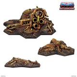 Toy battlefield setup with detailed terrain pieces on a white background, featuring 'Masters of the Universe Battleground' logo.