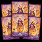 Set of Disney Lorcana trading card game packs featuring a bear character with a honey pot.