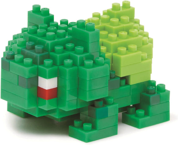 Green toy building block set shaped like a turtle on a white background