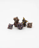 Set of metallic polyhedral dice on a white background