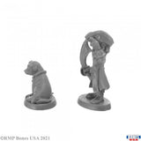 Two gray miniature figures of a person and a dog on a white background, with 'RMP Bones USA' branding.
