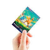 Hand holding a colorful trading card with fantasy creatures on a white background