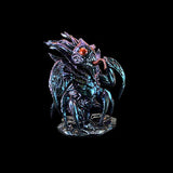 Metallic monster figurine on a black background