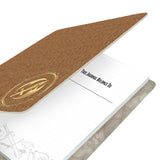 Journal with tan cover and 'This Journal Belongs To' text