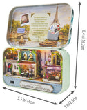 A Parisian-themed miniature diorama set inside a mint green metal tin, shown open to display the detailed interior scene with Eiffel Tower artwork and text. Black dimension arrows and labels indicate the tin's measurements: 6.