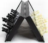 Foldable chess set with black and white pieces on a white background