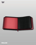 Open red and black card holder on a gray background