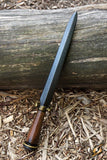 Knife with a wooden handle on a wooden log
