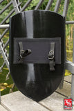 Black shield with straps on a metal railing