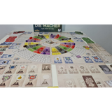 Board game with colorful pieces and cards on a white surface, featuring the brand 'Die Macher'.