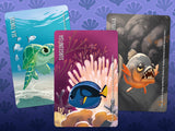 Three cards featuring sea creatures on a purple background with fish pattern