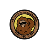 Circular patch with a bear-like creature and text 'Cryptids Gatherings The Big Foot' on a white background